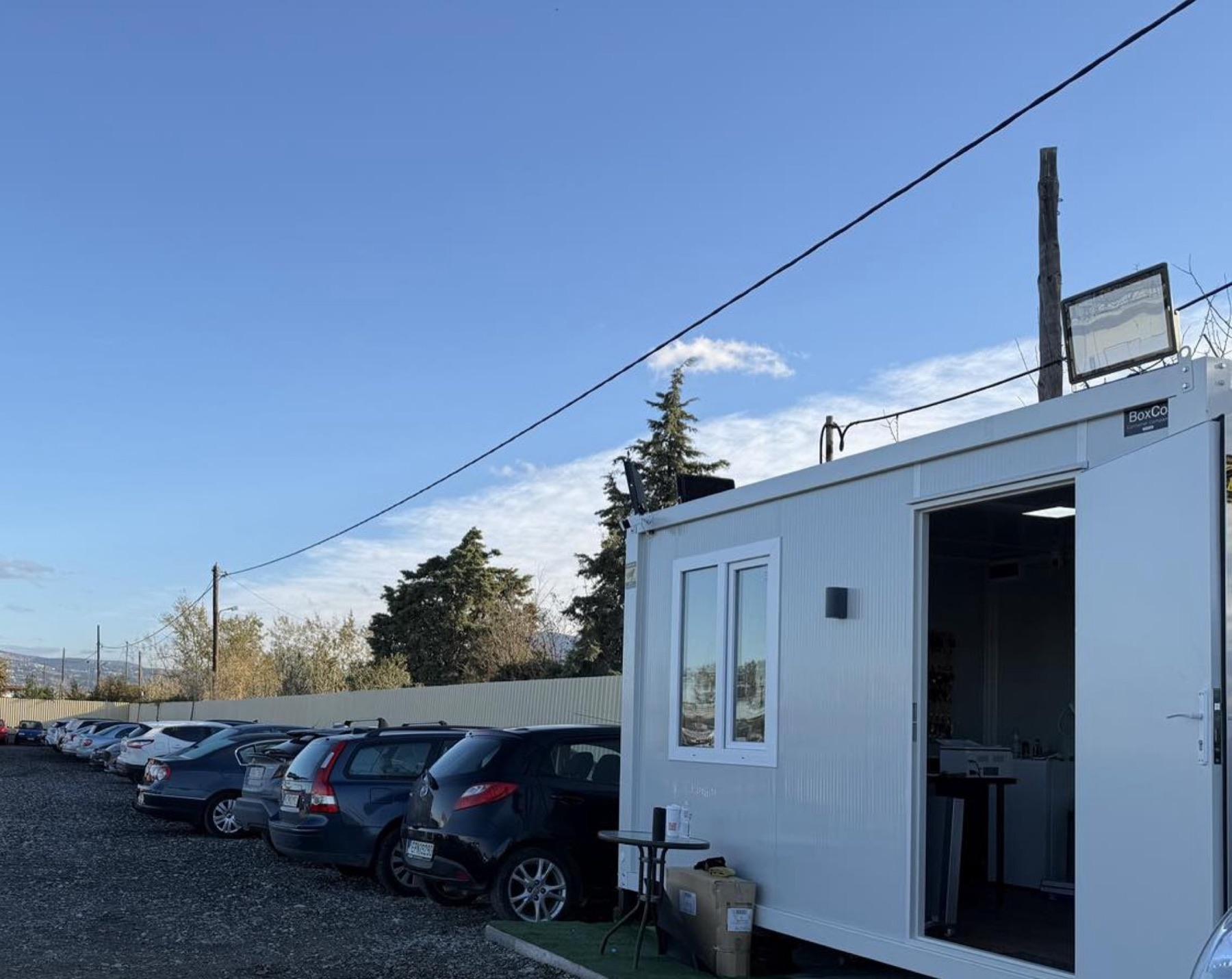 The Thess Airpark reception office next to the parked cars